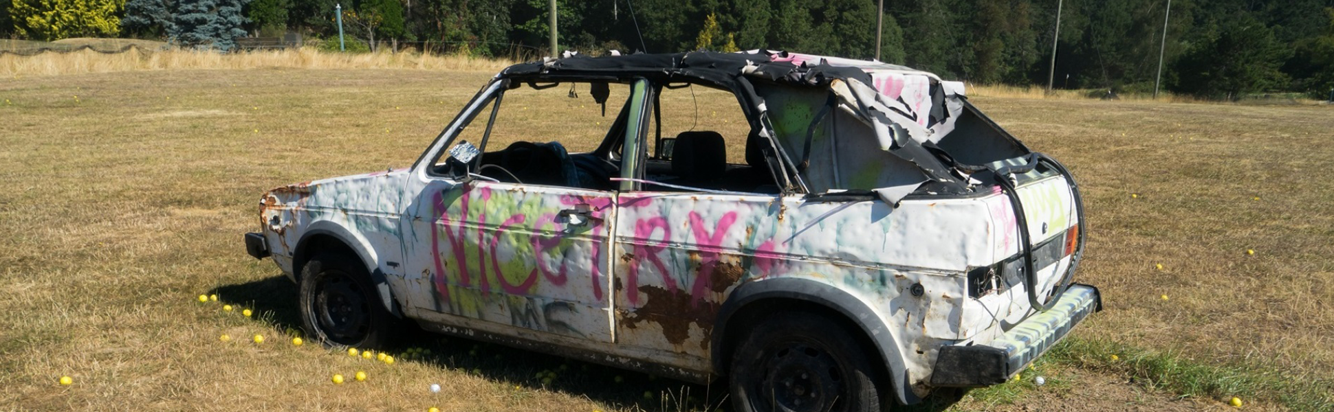 old car with graffiti on it